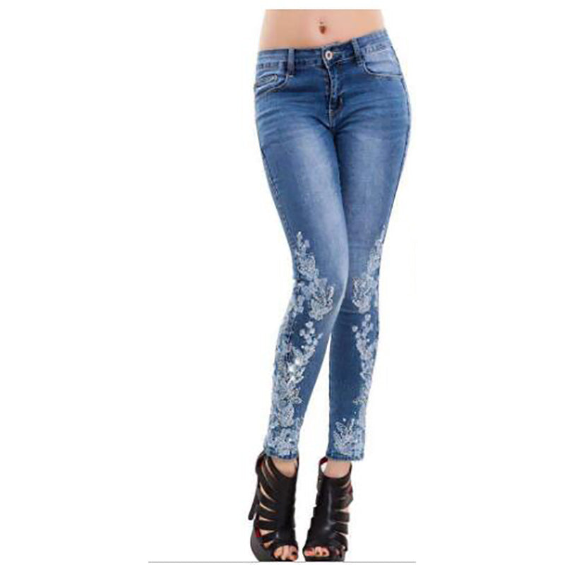 High-waisted embroidered jeans