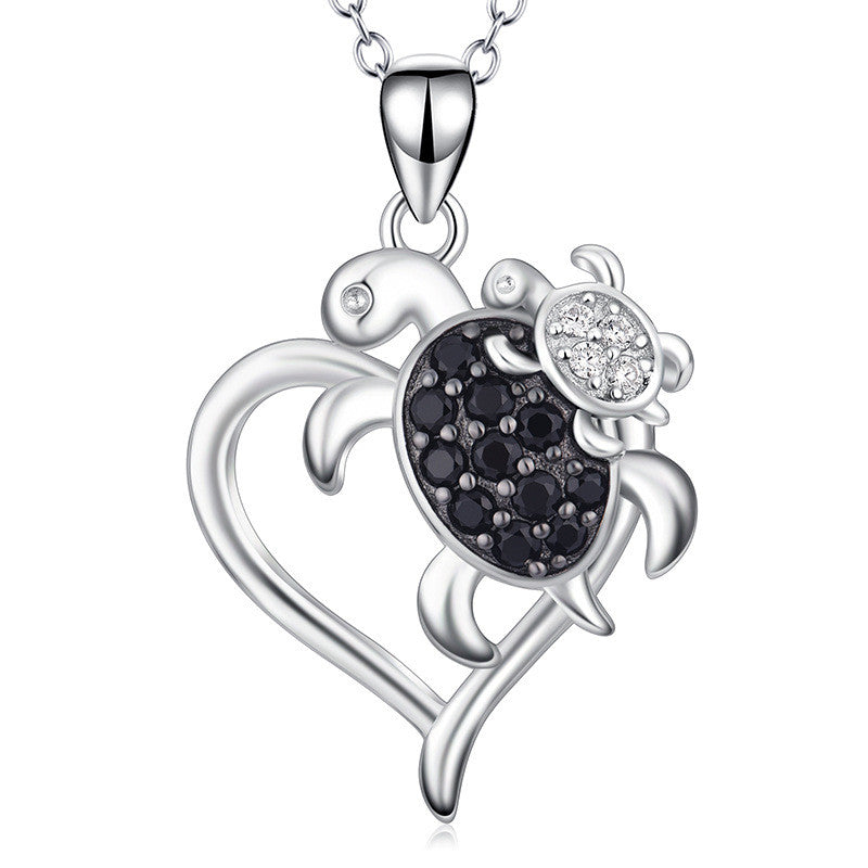 Tortoise mother and child zircon heart necklace