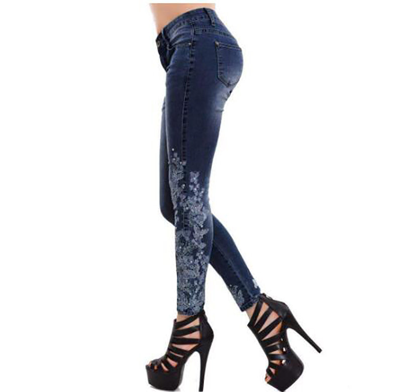 High-waisted embroidered jeans